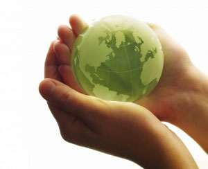 Hands holding green globe - newsletter icon